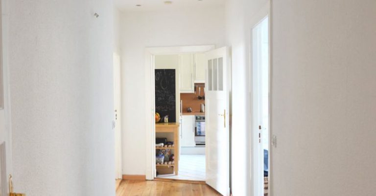 Keyless Entry - Long hallway with parquet in residential building