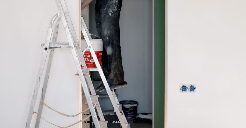 Lock Repair - Crop man doing renovation in room