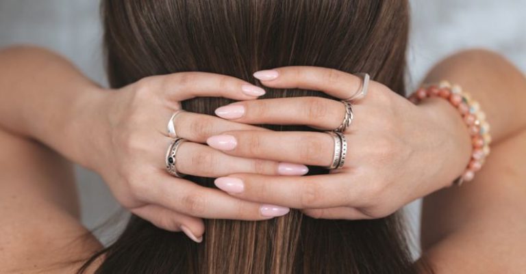 Lock Care - Woman touching back of head with crossed hands