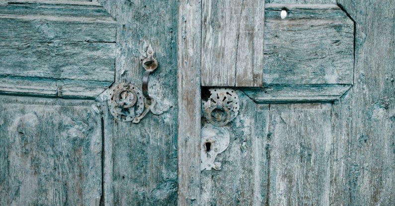 Worn-Out Lock - Shabby wooden blue doors with rusted locks