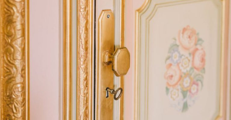 Lock Check-Ups - Close-up of Vintage Door with Gold Details and a Floral Pattern