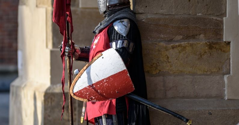 Safe - Man Wearing Gray and Red Armour Standing on the Streets