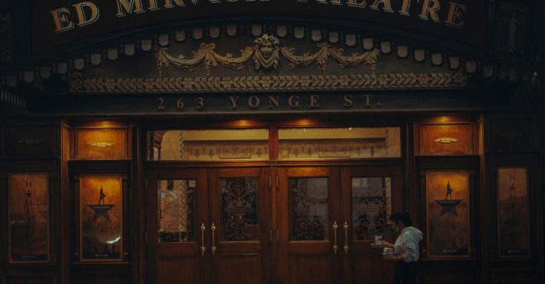 Door - A Woman Walking in Front of the Ed Mirvish Theatre