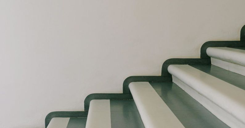 Keyless Entry - Stairway with striped stairs in residential building