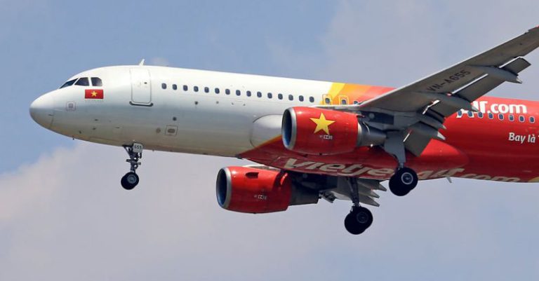 Commercial Locks - A vietnam airways plane flying in the sky