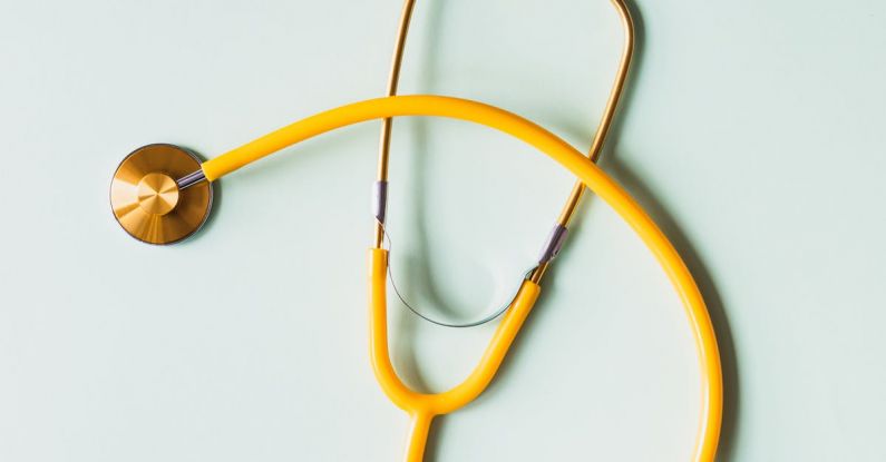 Emergency Lockouts - Top view of yellow medical stethoscope placed on white surface during coronavirus pandemic