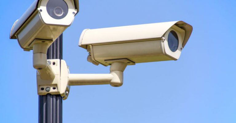 Security Cameras - White 2 Cctv Camera Mounted on Black Post Under Clear Blue Sky