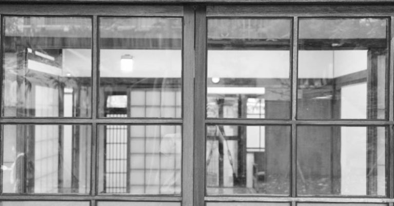 Windows And Doors - Black and white photo of a window with a reflection