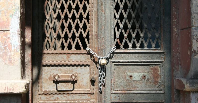 Lock Bumping - A door with a metal lock and a metal door