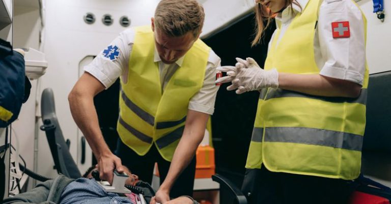 Emergency Services - Paramedics Using a Defibrillator on a Patient