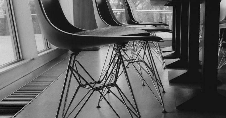 Office Lockout - Black and white photo of chairs in a room